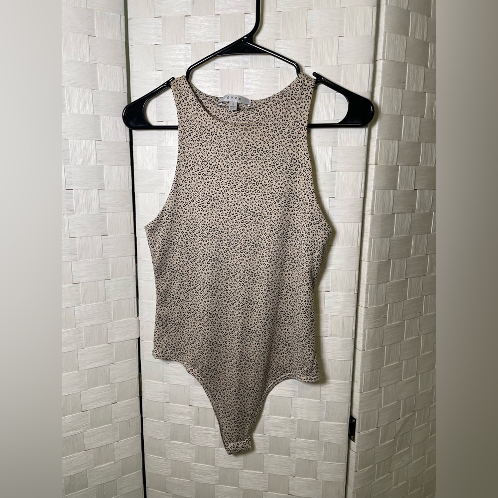 Gaze Cream and Black Asymmetrical Fitted Bodysuit